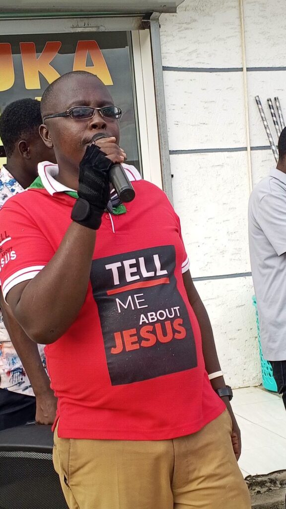 International Evangelist Charles Runo preaching the Gospel during a Jesus Changing Lives Ministries street evangelism outreach in Nairobi, Kenya.